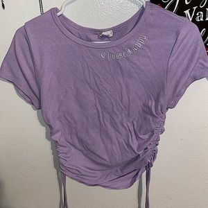 It’s a purple shirt, brand is SHEIN, it’s a size small